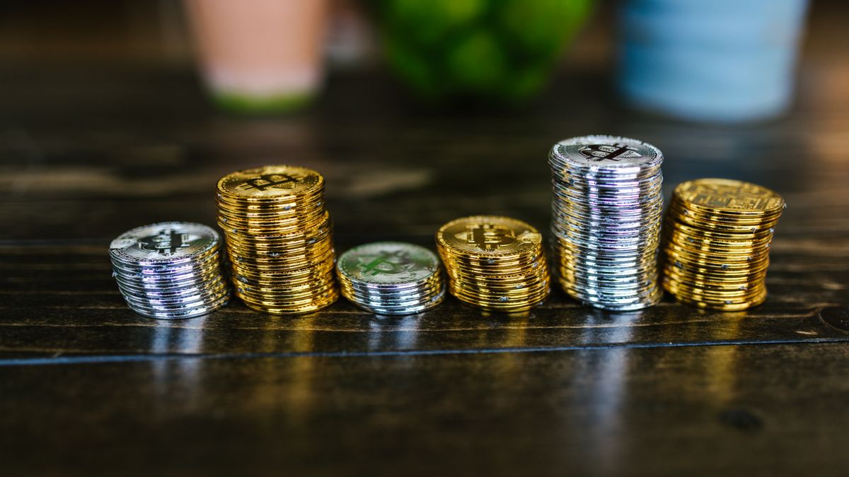 Crypto mining tax explained with mining rig and tax form illustration